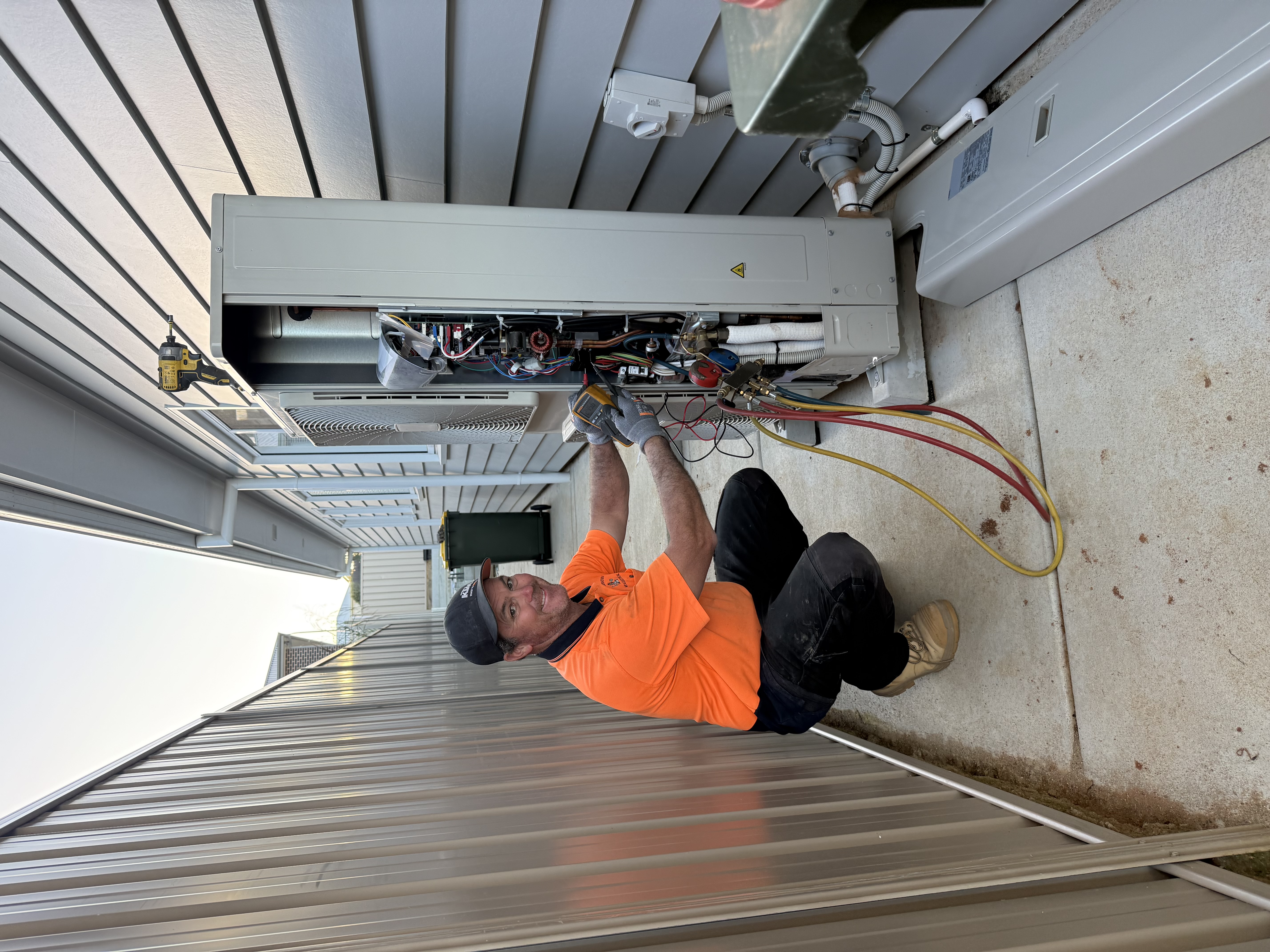 JMS Dual Trade Qualified Technician servicing HVAC unit
